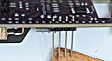 Next is the extra-long header for the OLED. Position it as shown, splayed outward from the side of the HBG3 PCB.