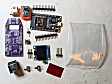 The full parts kit, including OLED, is shown.The kit also includes a short AUX cable (not shown).Even simpler builds are possible. The bare minimum would be the PCB, the ESP32, the 5V buck power supply module, and the RJ12 jack. Everything else is optional.